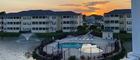 Beautiful sunset from private, top floor deck, overlooking community pool