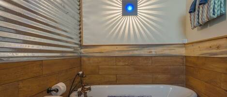 Luxuriously relaxing clawfoot soaking tub in our spa-like bathroom