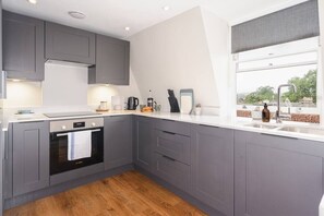 The kitchen is well equipped and comes complete with: fridge, freezer, hob, oven, dishwasher and washing machine.