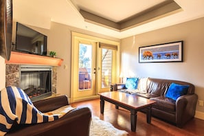 Curl up to a movie with the family in this spacious living room