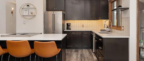 Open kitchen with quartz and new stainless appliances