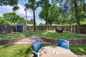 Experience the ultimate in outdoor living in our sprawling backyard, complete with lush greenery, comfortable seating, and plenty of space to enjoy the fresh air and sunshine