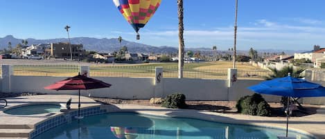 Private pool and Jacuzzi with the golf course over the wall.