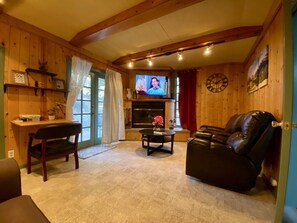 Living Room: 55" Smart TV, Spectrum Cable, Wi-FI, & fire place
