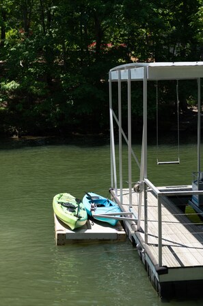 Two kayaks, paddles, and life jacket to enjoy