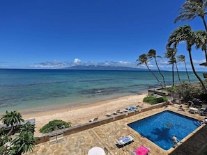 The view of the beach and pool from the balcony