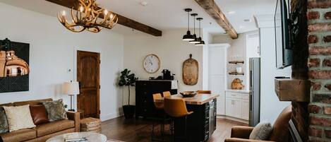 Living room and kitchen area of Issaqueena Suite. 