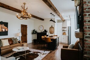 Living room and kitchen area of Issaqueena Suite. 