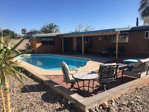 Enjoy the private pool with plenty of outdoor seating and lounging areas.