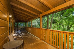 Calm and privacy, back to nature on the covered deck under a canopy of trees.