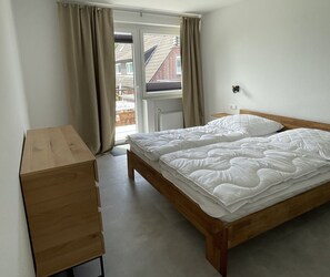 Ferienwohnung Brandung mit 50qm, 1 Schlafzimmer, Balkon mit Blick in Garten, max. 2 Personen