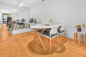 dining table seats 4.  Sliding opaque glass doors can close off bedroom