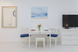 Dining table with tableware.