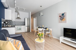 Kitchenette with dining area and living room.