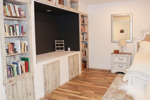 Exceptional book collection adds to the homey feeling of this spacious bedroom. 