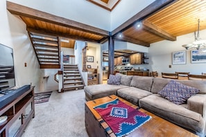 Living room - Living area, dining area, and kitchen all flow together nicely within the open floor plan.