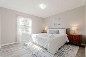 Minimalist Bedroom with pillows and towels