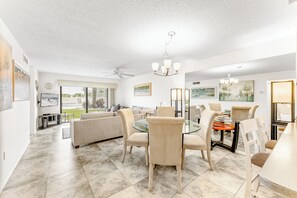 Elegant dining area with open-concept living and natural light.