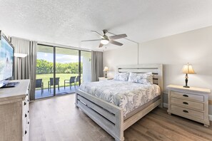 Unwind in the serene master suite with a king bed and oceanfront patio