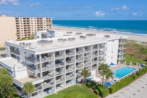 Take in a breathtaking aerial view of the Cape Winds building and pool