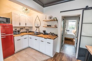 Well appointed kitchenette with stylish finishes, ideal for a comfortable and convenient stay in Downtown Redding.