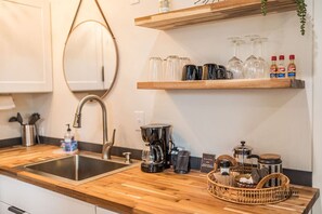 Stylish kitchenette featuring modern design and everything you need for your stay in Downtown Redding.