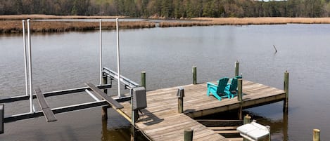 Waterfront with large dock with kayak ramp.