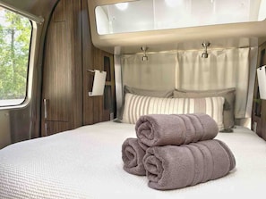 The non-standard queen-sized bed is 12" inches shorter than a regular queen, but it is the same width. So, if you are above 6'2'', your feet might free-float :)