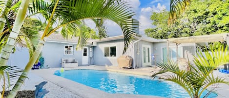 Relaxing in our spacious backyard and private pool with lounge chairs 