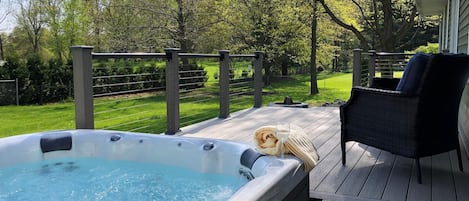 Welcome to your Home Away From Home! Beautiful backyard and hot tub! Can't you see yourself relaxing the evening away? 