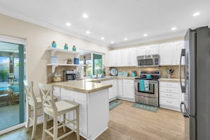 The kitchen is equipped with a comprehensive array of amenities.