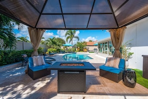 Discover the star feature of this vacation home: an outdoor oasis.