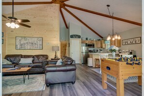This updated cabin has LVP flooring and an open-concept living/kitchen/dining.