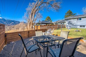 Take in breathtaking mountain views while enjoying a meal or gathering around the fire pit in this serene outdoor space