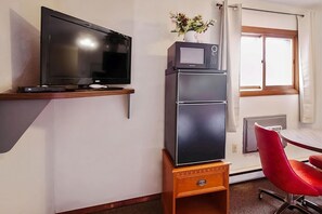 Unit with a flat-screen TV, microwave and mini-fridge