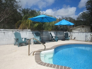 Sturdy and comfortable adirondack chairs to relax by the pool in.
