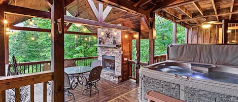 Outdoor gas fireplace, dining table, hot tub