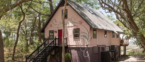 The beautiful cottage style home with painted details on the exterior of the home.