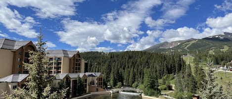 View from the Condo.  Paddle Boarders on the Maggie with Ski Area Views