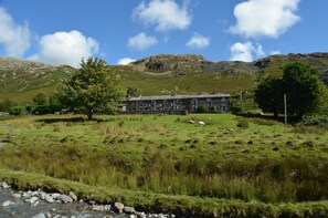 Distant view of Fellside Cottage in Coppermines Valley Lake District