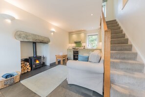 Fellside Cottage sitting room with log burning stove