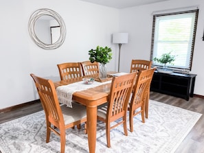 Gather Around the Spacious Dining Table and Share a Fantastic Meal Together