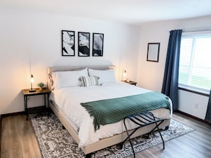 Bright & Airy King Bedroom featuring Plush Bedding and Blackout Curtains