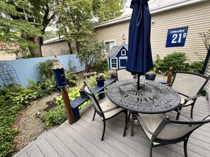 peaceful fenced in backyard dining area and garden