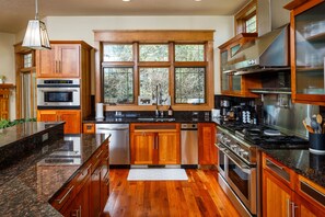 The large kitchen includes plenty of seating at the breakfast bar