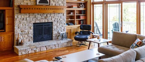 Welcome to Cottage Row Retreat in Fish Creek. The living room is full of gorgeous interior craftsmanship