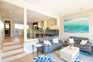 Bright living room that opens to the kitchen and dining area