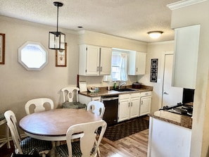 Updated, modern kitchen with dining area.