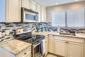 Updated Kitchen with Granite Countertops and Stainless Steel Appliances