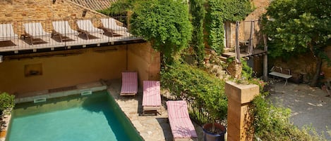 pool and sunbeds in the garden